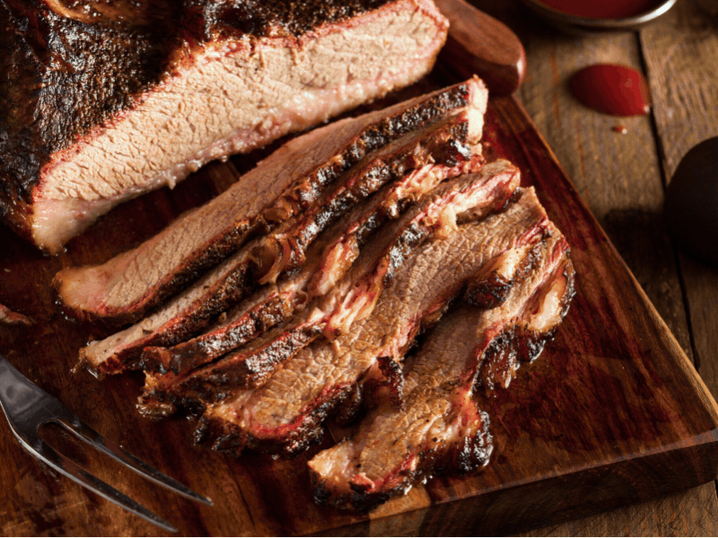 Different brisket dishes on a table